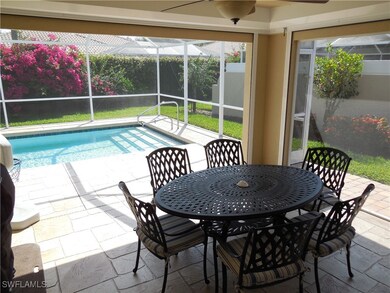 View of swimming pool featuring a patio, glass enc