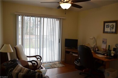 Bedroom currently used as an office with sliding glass doors to back deck