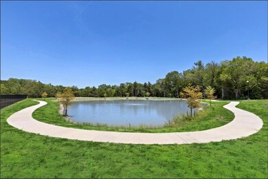 View of community featuring a water view and a yar