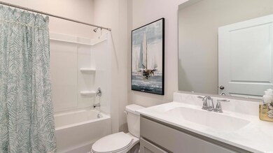 Full bathroom with vanity, shower / tub combo with