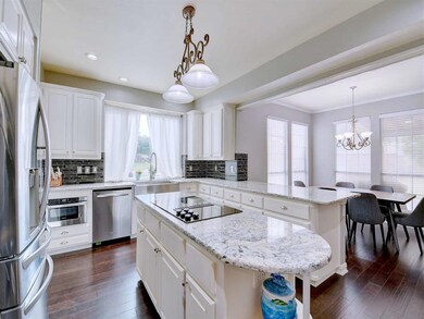 Love that kitchen and breakfast bar!