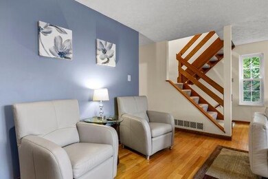 Living room has additional seating for entertainin