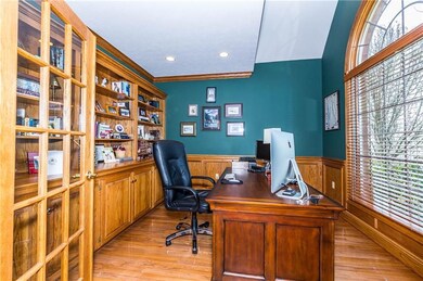 FIRST FLOOR DEN WITH HARDWOOD FLOORS AND BUILT-INS