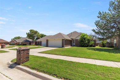 Ranch-style home with an attached garage, concrete driveway, brick siding, and roof with shingles
