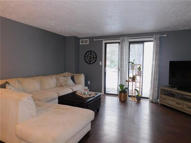 Living room with laminate flooring.