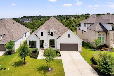 French country style house with a garage, concret