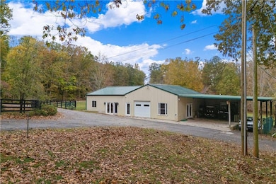 Garage featuring a carport