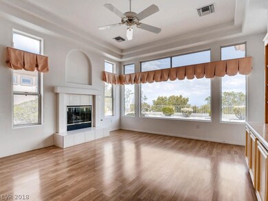 FAMILY ROOM FEATURES LAMINATE FLOORS, FIREPLACE AN