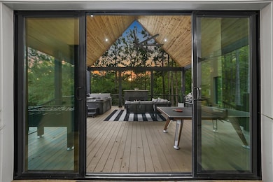 Doorway to outside with lofted ceiling