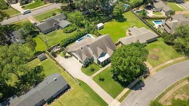 Aerial perspective of suburban area with a pool