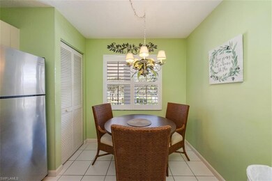 Dining room featuring light tile patterned flooring and a chandelier