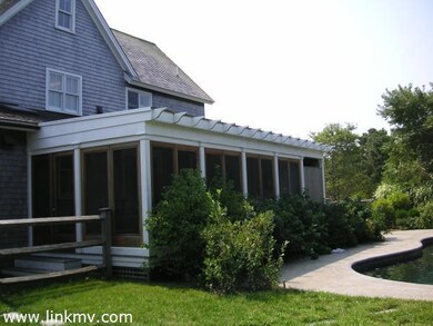 Screen porch overlooking pool