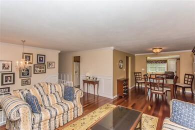 Crown molding and Brazilian cherry hardwoods throu
