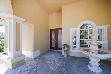 Front paver brick portico with fountain
