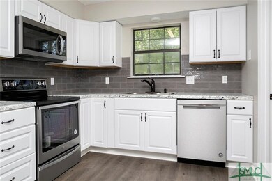 Updated kitchen offer granite counters and new sta