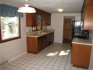 Kitchen with ceramic tile floor and solid surface 