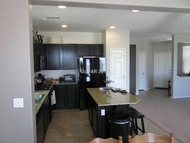 Property Photo. Kitchen overlooks Family Room and