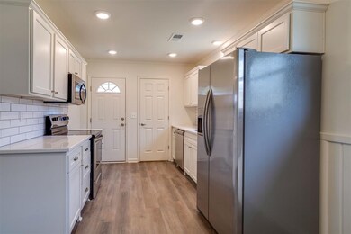 Enter kitchen from covered carport.  Laundry room is on the right.