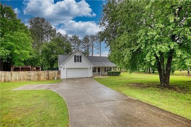 View of front of property featuring driveway and a