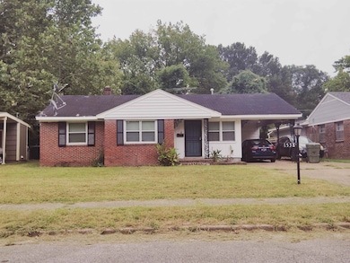 Single story home with a front yard, driveway, an attached carport, a chimney, and covered porch