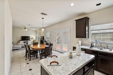 Kitchen, breakfast area and living room.