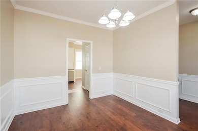 Unfurnished dining area featuring a chandelier, cr