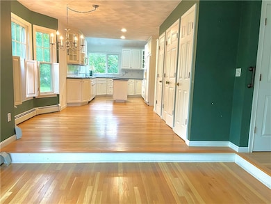 Front to back kitchen /dining area  with  sunny co