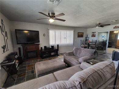 Living room featuring ceiling fan