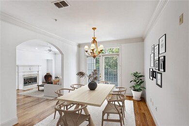 Dining space featuring a premium fireplace, light 