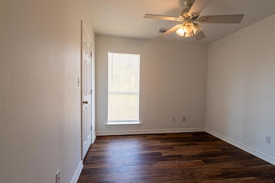 Spare room featuring dark hardwood / wood-style fl