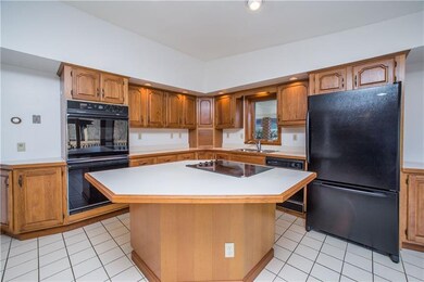 Features oversized island, breakfast bar and heate