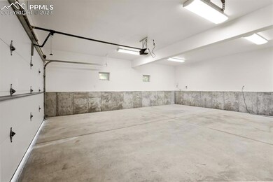Deep oversized two car garage with entry into the 