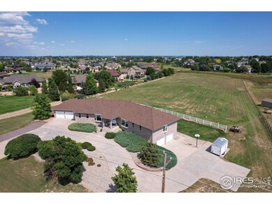 Ranch home with Dual 2-Car Garages on either side of the house. 5+ acres of level, usable land