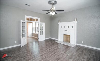 Living room with entry to dining.