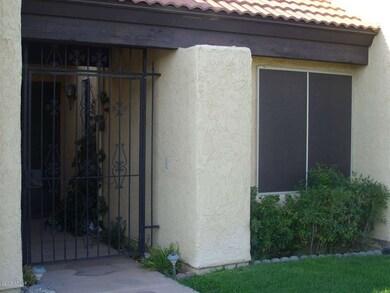 Security gate leading to front doors