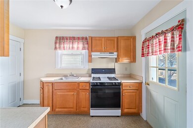Updated kitchen with solid wood cabinets, gas stov
