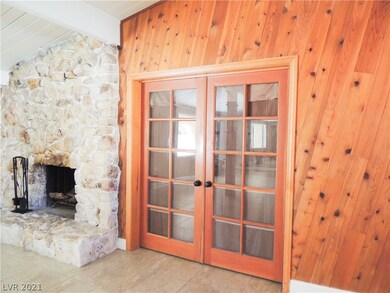 French doors into Den and primary bedrooms