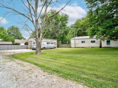 Large yard, mature trees and partially fenced.