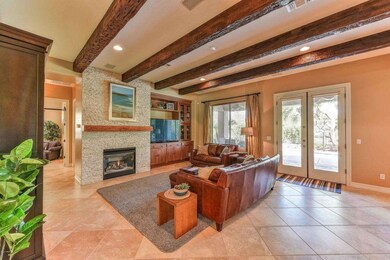 Fireplace, french doors and beams!