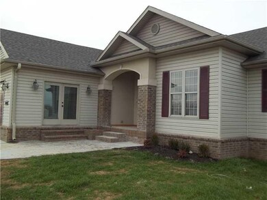 Exterior Front. French doors lead from the extra l