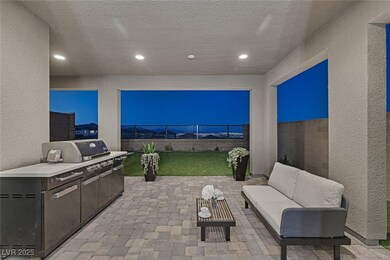 View of patio with exterior kitchen, a fenced back