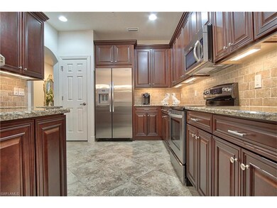 kitchen includes upgrades like 42 inch upper and cherry glaze cabinets with granite. Stainless Steel appliances. Gorgeous back splash with granite counter tops. Note pantry next to refrigerator.