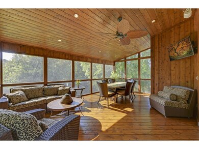 Incredible 3-season porch overlooking large Wooded