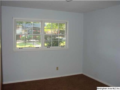 Bedroom 1, hardwood floors under the carpet
