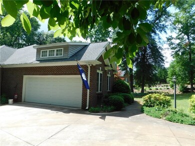 2 car garage with bonus room over, enter from insi