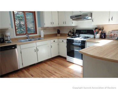 Kitchen. Freshly painted cabinets and new stainles