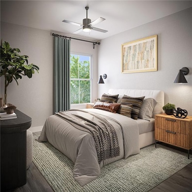 Bedroom featuring wood finished floors and ceiling fan