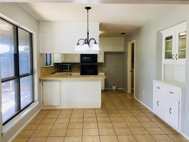 dining room and Kitchen showing off built in china