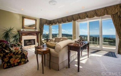 Formal living room with white water ocean views an