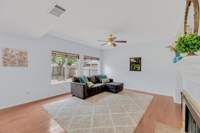 Living room with light wood-style flooring, a fir